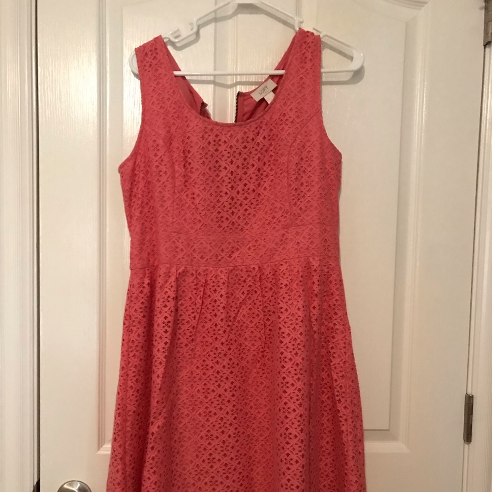 Women’s pink knee length dress.